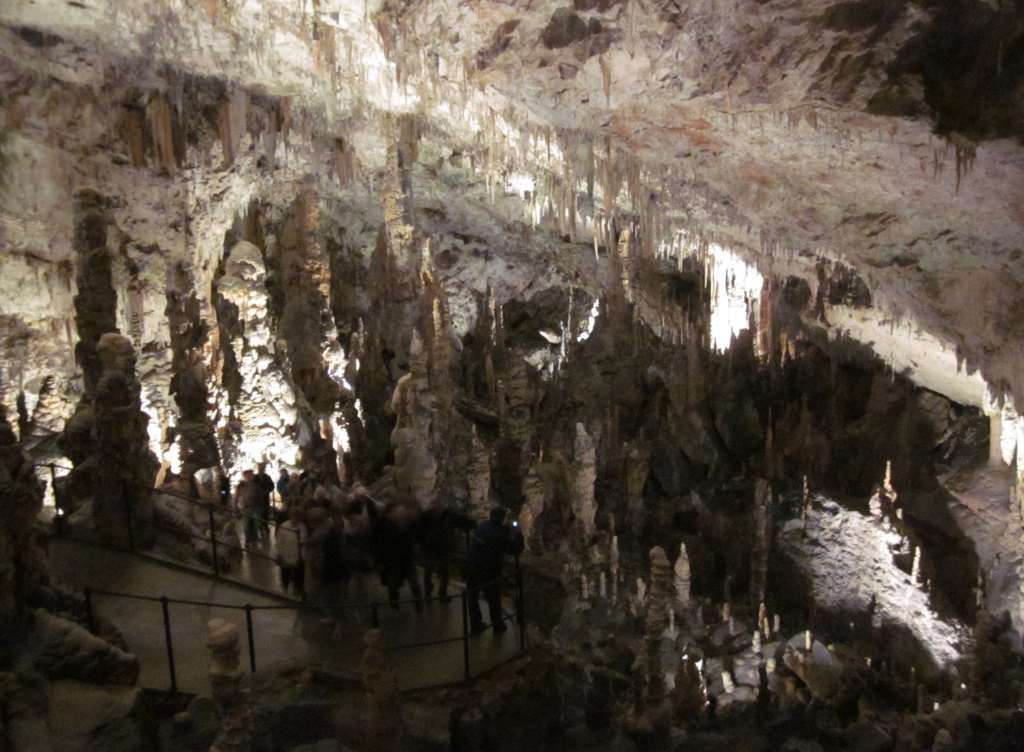 Tourists walking inside the cave