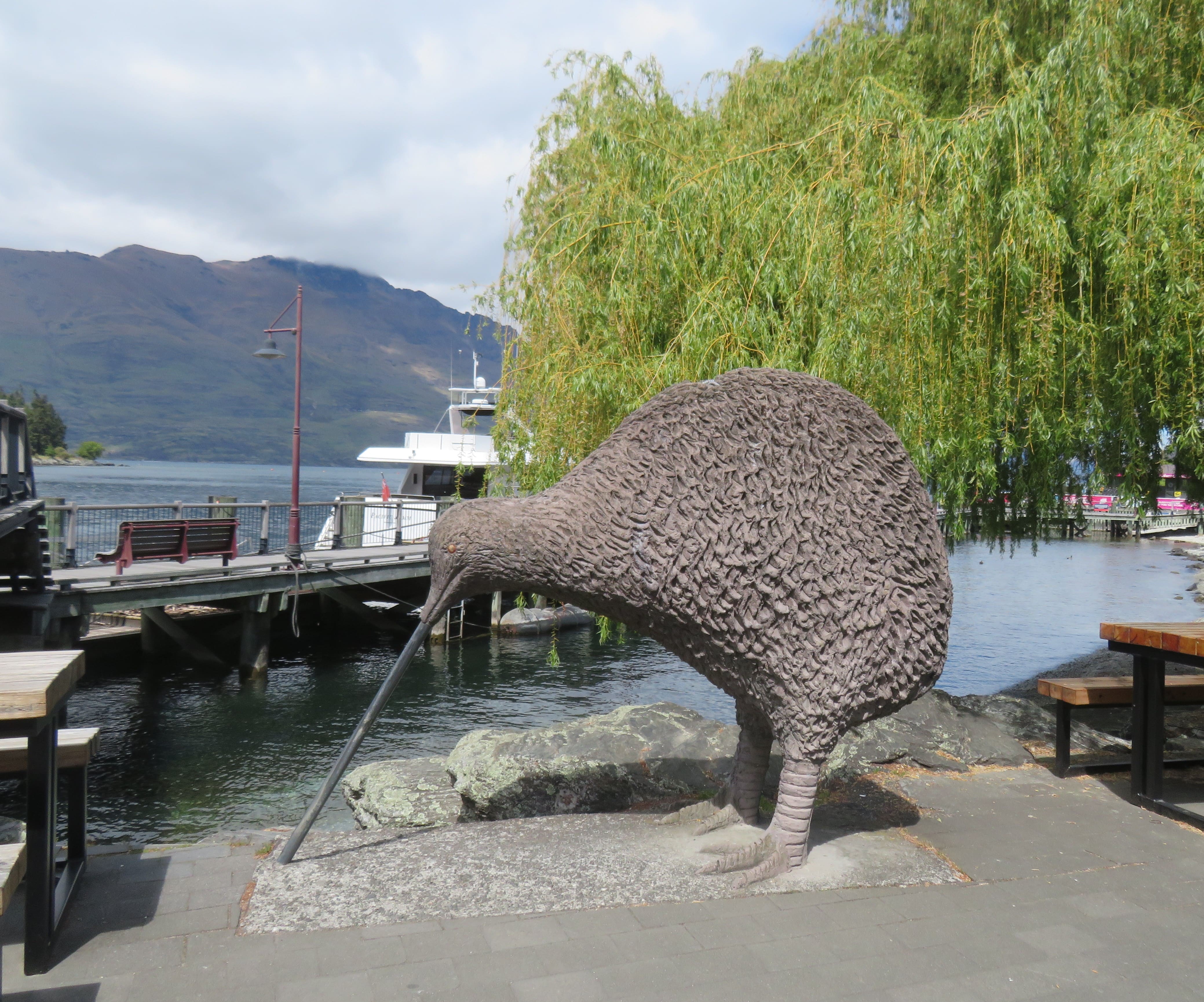 A giant Kiwi statue by the lake