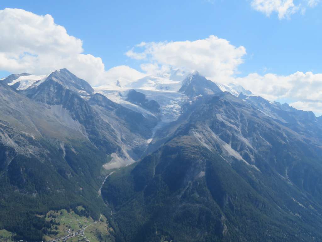 We could see a valley down there and many snowcapped mountains across.