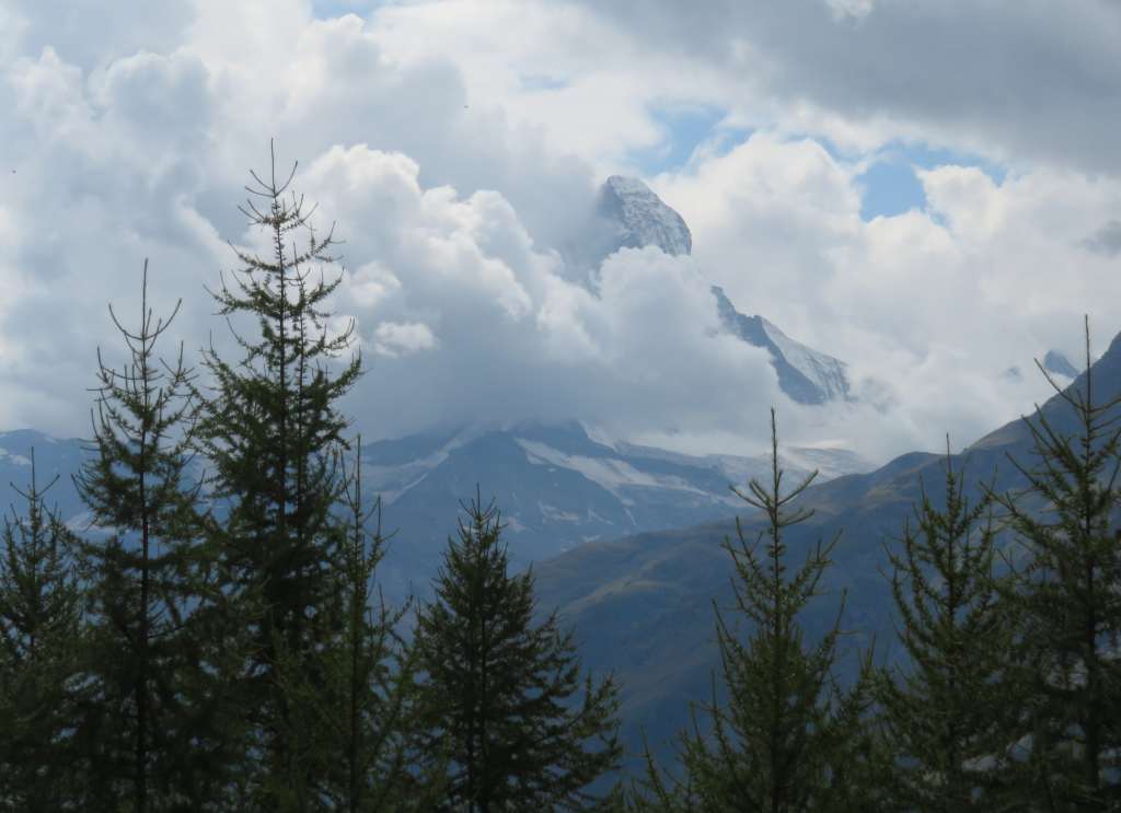 Matterhorn partially covered by cloud