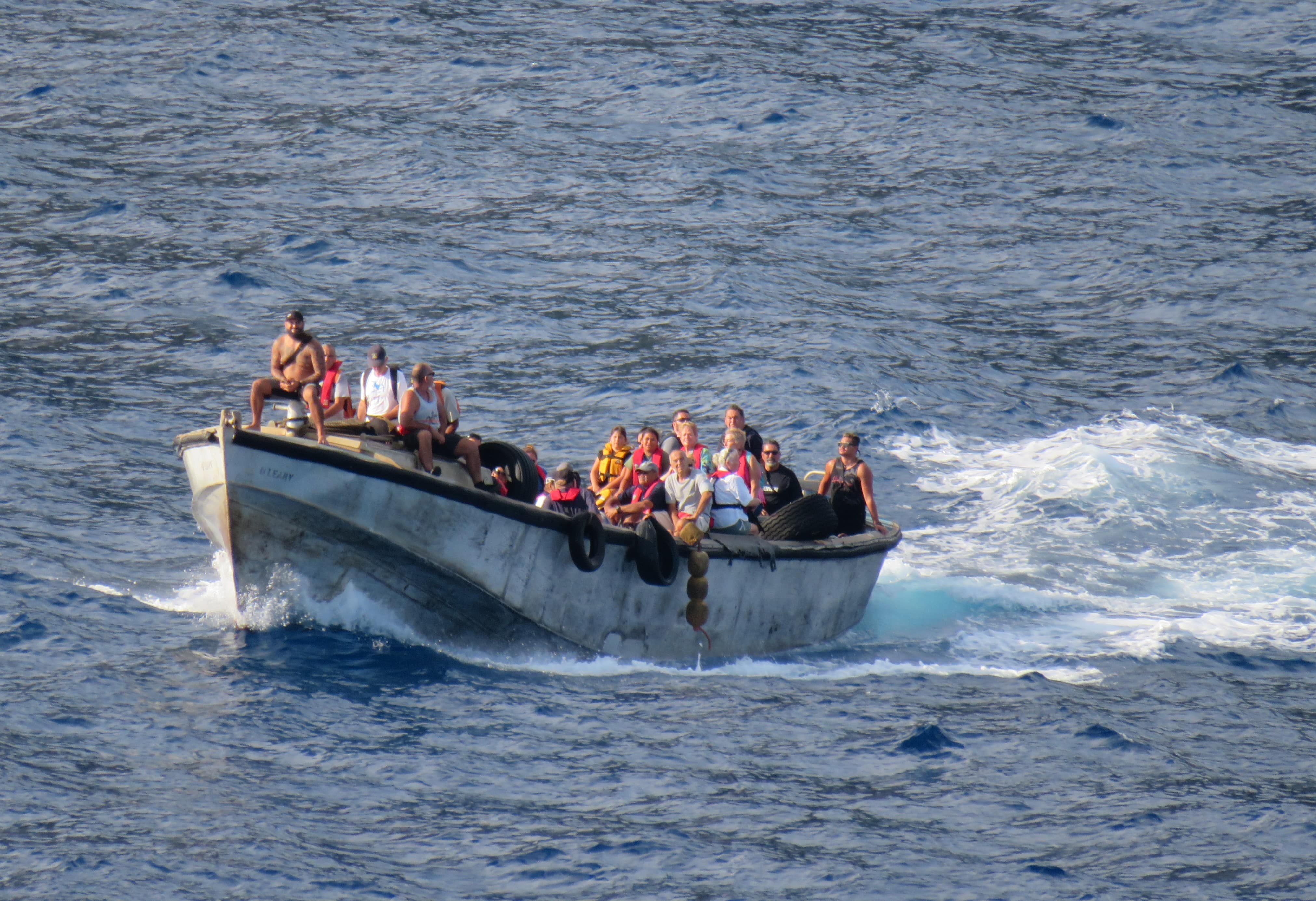Pitcairn residents arriving in a small boat