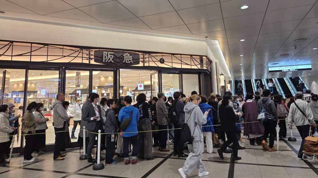 People waiting to enter department store